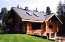 Tersago House - 1200 sq.ft. on the main floor plus 700 sq.ft. in the loft; interior log wall featuring the "mushroom" arch on our Home Page